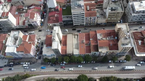 Aerial view of dense urban blocks and highways with heavy city traffic Video stock 337462806