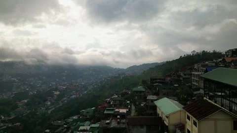 Aerial view of densely populated hillside city with dramatic cloudy sky and.. Stock Footage 337769192