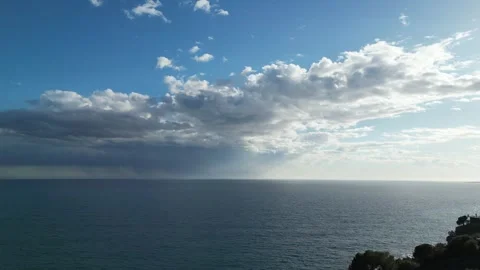 Aerial view from a descending drone of cloudscape and sea horizon, 4K Stock Footage 274843688