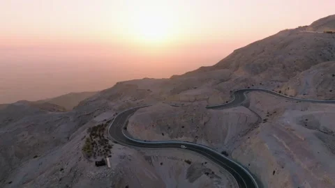 Aerial view of desert mountain windy roads, concept shot for an adventurous road Stock Footage 320244690