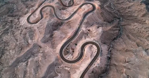 Aerial view of desert mountain windy roads, concept shot for an adventurous road Stock Footage 320245001