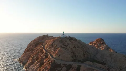 Aerial view of a desolated lighthouse in the middle of a desert island in the Stock Footage 157537482