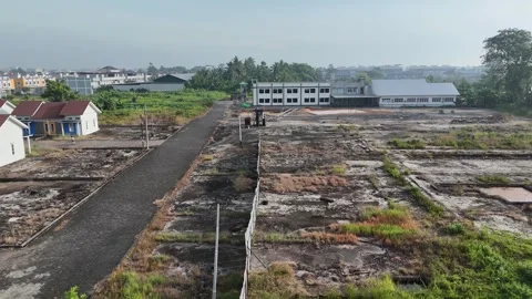 Aerial View of Developing Area with Paved Roads and Vacant Lots Stock-Footage 347442086