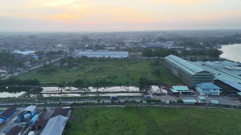 Aerial View of Developing City and Sunrise Industrial Complex Vídeo Stock 347150982