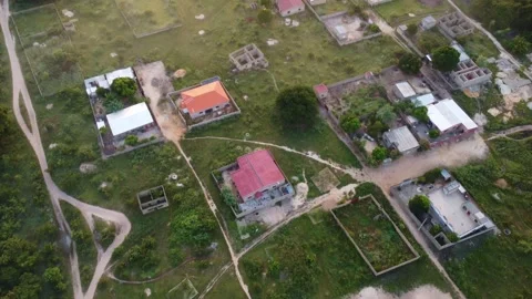 Aerial view of a developing residential area with houses and vegetation Stock Footage 318723352