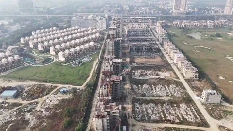 Aerial view of a developing residential township in Noida, showing Stock Footage 327715848