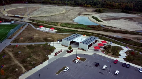 Aerial View of a Development Site, Parking Area, and Café Stock-Footage 347151006