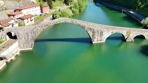 Aerial view of Devil's Bridge Ponte della Maddalena Borgo a Mozzano over Se.. Stock Footage 333864060