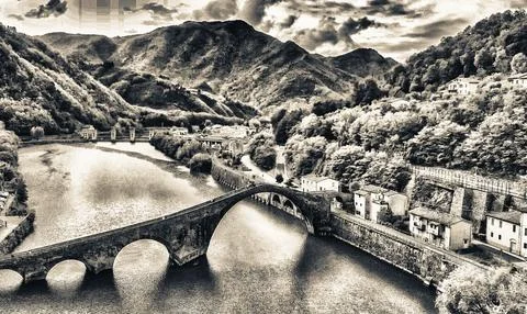 Aerial  view of Devils Bridge - Ponte della Maddalena is a bridge crossing .. Stock Photos