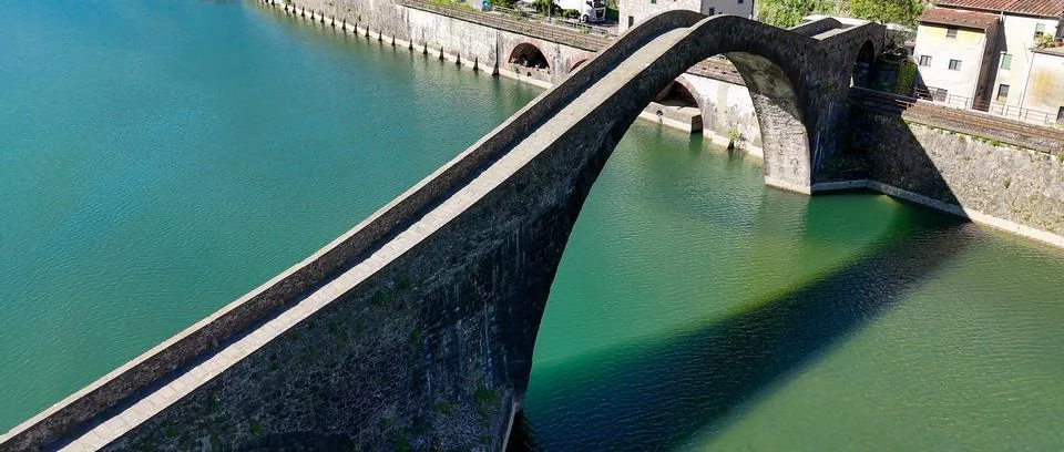 Aerial view of Devil's Bridge Ponte della Maddalena Borgo a Mozzano over Se.. Stock Photos