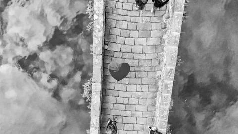 Aerial  view of Devils Bridge with tourists and heart shape umbrella - Pont.. Stock Photos