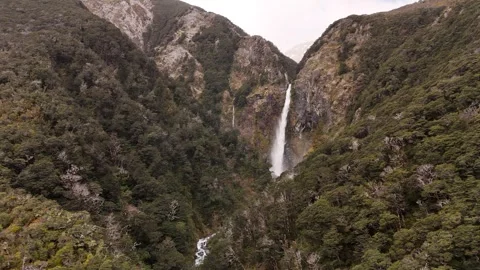 Aerial view of Devils Punchbowl Waterfall in Arthur’s Pass, South Island of New Stock Footage 333355978