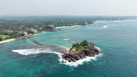 Aerial view of Devil's Rock and the tropical coastline, Sri Lanka. Stock Footage 335906810