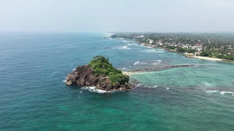 Aerial view of Devil's Rock and the turquoise coastline, Sri Lanka. Stock Footage 335906818