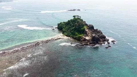 Aerial view of Devil's Rock island and its rocky sandbar, Sri Lanka. Stock Footage 335906858
