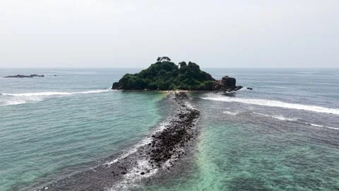 Aerial view of Devil's Rock island and turquoise ocean, Sri Lanka. Stock Footage 335906882