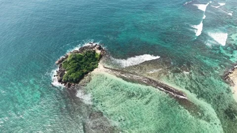 Aerial view of Devil's Rock island and coral reefs, Sri Lanka. Stock Footage 335906907