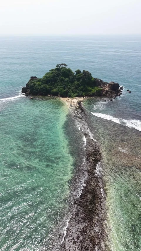 Aerial view of Devil's Rock island and turquoise sea, Sri Lanka. Stock Footage 336325934