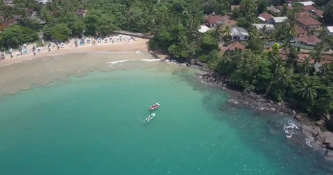 Aerial view of Devinuwara Beach with many fishing boats, blue clear ocean Vidéo 201170748