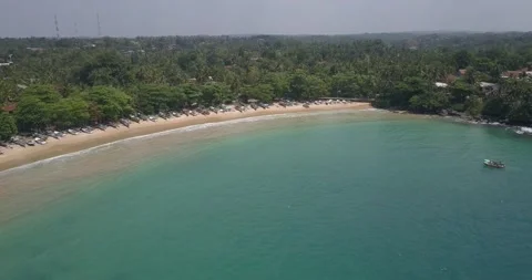 Aerial view of Devinuwara Beach with many fishing boats, blue clear ocean Vidéo 201170752
