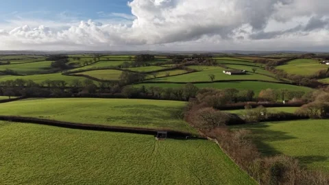 Aerial view of Devon and Cornwall countryside on a sunny winters day Stock Footage 326921352