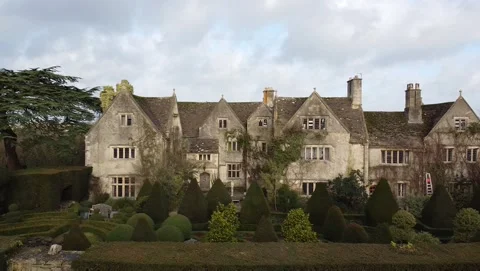 Aerial view, diagonal rise up move. Flying over an old abbey in Malmsbury, UK Stockbeeldmateriaal 138208586