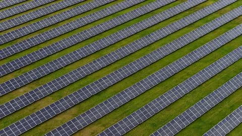 Aerial View of Diagonal Solar Panel Rows in Green Landscape Germany Fotos Stock