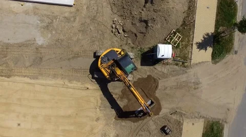 Aerial view of a digger  tracked excavators at work on a construction site Stock Footage 63974597