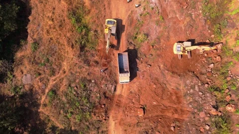 Aerial view of diggers along tilt vehicle at scarlet terrain Stock Footage 297239193
