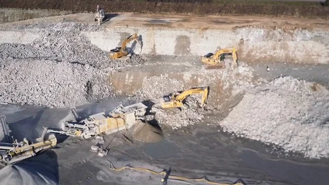 Aerial view of digsite. Heavy digging machinery in mine. Excavation equipment Video stock 125396001