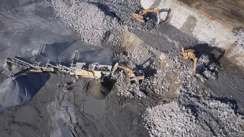 Aerial view of digsite. Heavy digging machinery in mine. Excavation equipment Stock Footage 125396019