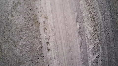 Aerial view on dirt path of a former desert race track course Stock Footage 92108661