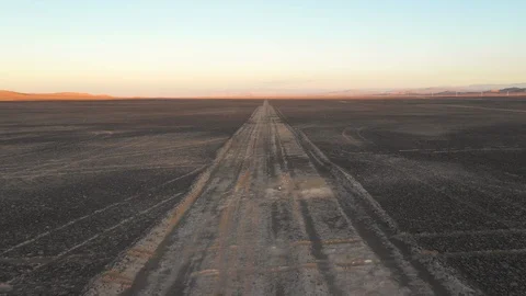 Aerial view of a dirt road to infinity at Atacama Desert outdoors at sunset time Vídeo Stock 125621207