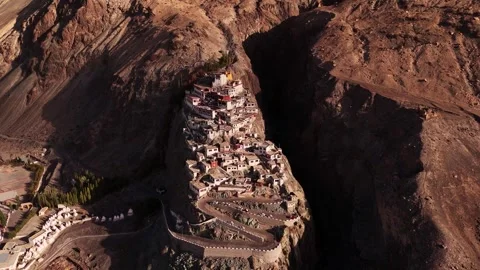 Aerial view of Diskit Monastery perched dramatically on a rocky hilltop in Stock Footage 310900491