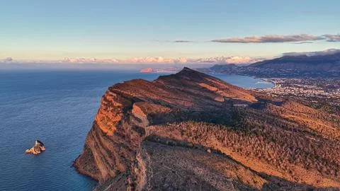 Aerial View Of Distant Cliffs, Cinematic Image Showcasing Layered Coastline And Stock Photos