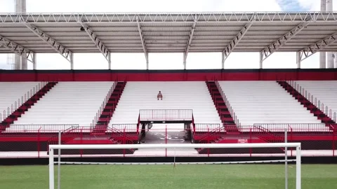 Aerial view of distant lonely guy inside an empty football pitch Stock Footage 150769867
