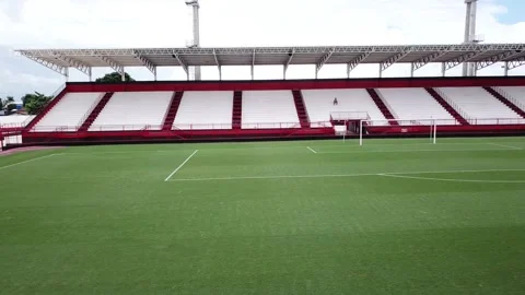 Aerial view of distant lonely guy inside an empty football pitch Stock Footage 150769881