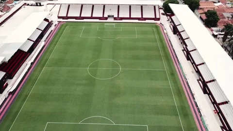 Aerial view of distant lonely guy inside an empty football pitch Stock Footage 150769916