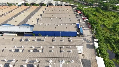 Aerial view of distribution warehouses of several companies lined up neatly.. Video stock 337014262