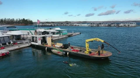 Aerial View Of Diver Returning To Work Barge And Waving At Drone. 4K Stock Footage 152422578