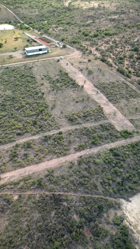 Aerial view of divided land parcels and dirt tracks Stock Footage 342061574