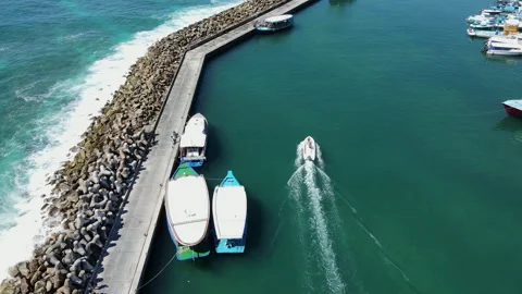 Aerial view of diving boat speeding at Fuvahmulah Harbour, Maldives Stock Footage 243922235