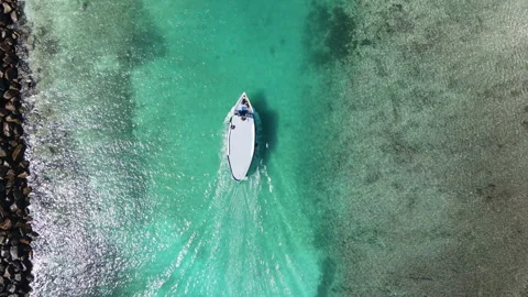 Aerial view of diving boat speeding to the port at Fuvahmulah, Maldives Stock Footage 243922256