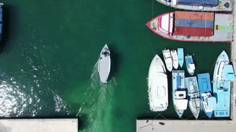 Aerial view of diving boat speeding to the port at Fuvahmulah, Maldives Stock-Footage 243960221