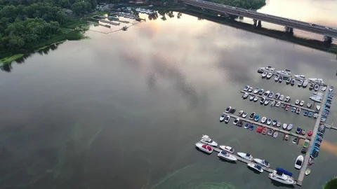 Aerial view of Dnipro River heading towards the right bank at sunset, Kyiv Ci Stock Footage 113220667