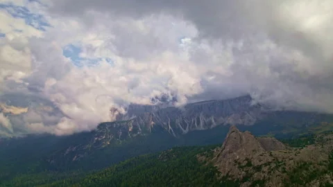 Aerial view of the Dolomites through the clouds Stock Footage 220601033