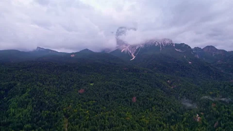Aerial view of the Dolomites through the clouds Stock Footage 220665096
