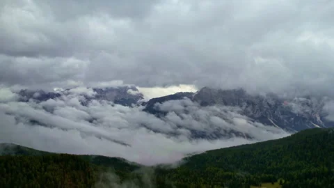 Aerial view of the Dolomites through the clouds Stock Footage 220665691