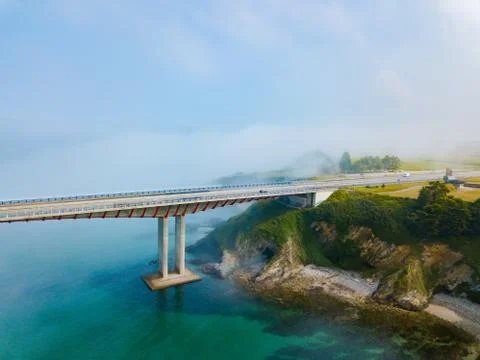Aerial view on dos Santos bridge during fog and bay. Near Ribadeo in Northern Stock Photos