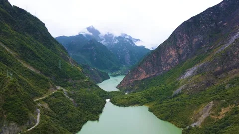 Aerial view of double branch river valley green lake green mountain forest Stock Footage 337926572
